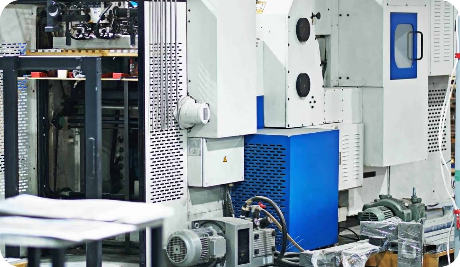 Modern factory machinery undergoing preventive maintenance to ensure high uptime for global operations