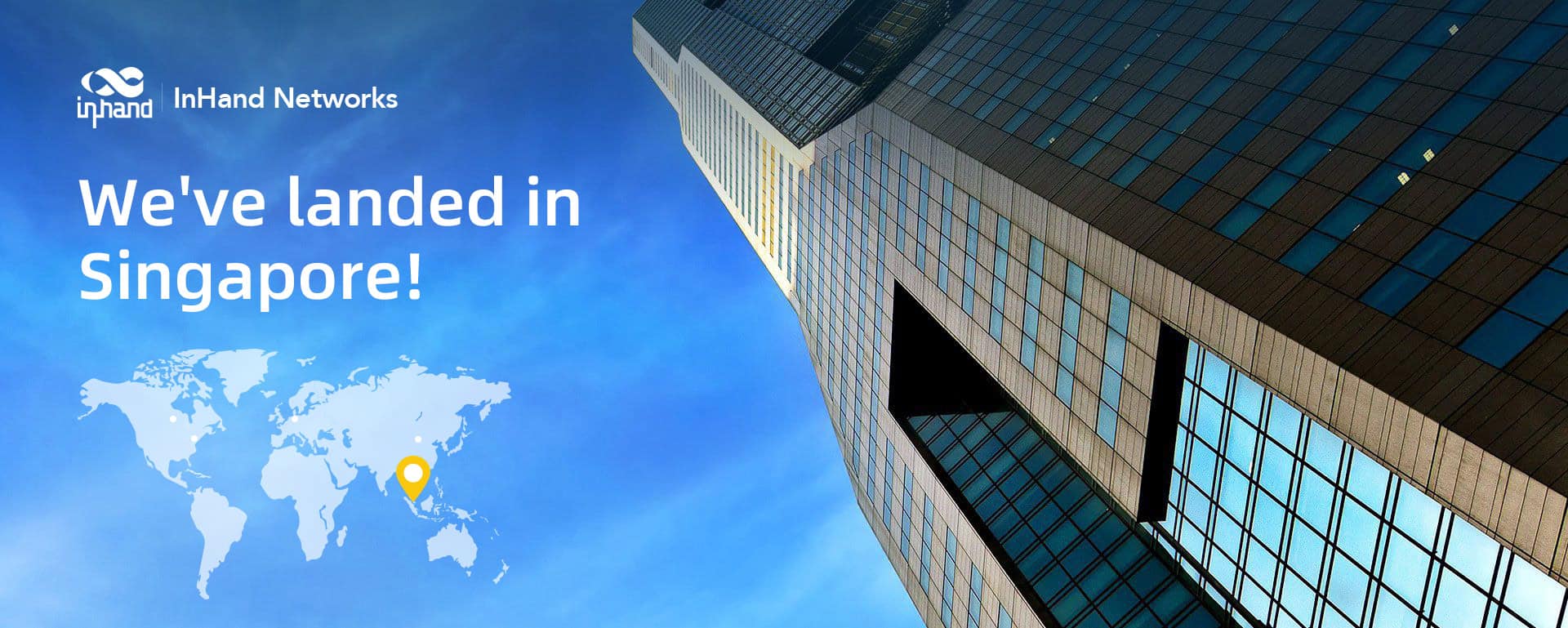 Exterior de un moderno edificio de oficinas en Singapur que muestra el logotipo de InHand Networks junto a la entrada, ilustrando su presencia global.