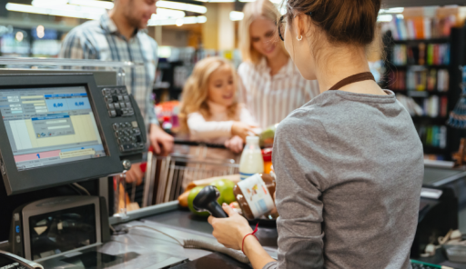 beautiful-family-standing-cash-counter