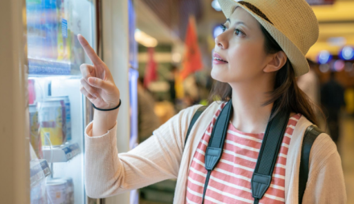 woman-buying-things-from-vending-machine-sure-what-drink-looking-uncertain-relaxing